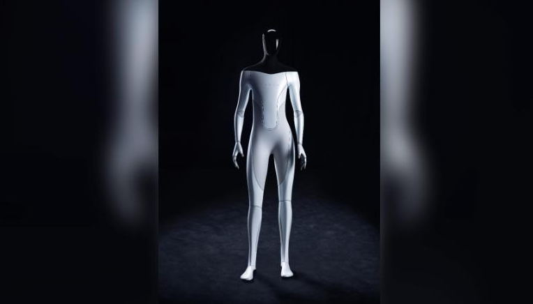 Elon Musk just added a robot to his list of things always coming 'next year.' For now he's got a guy in a suit